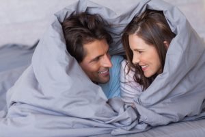 cheerful-couple-in-bed
